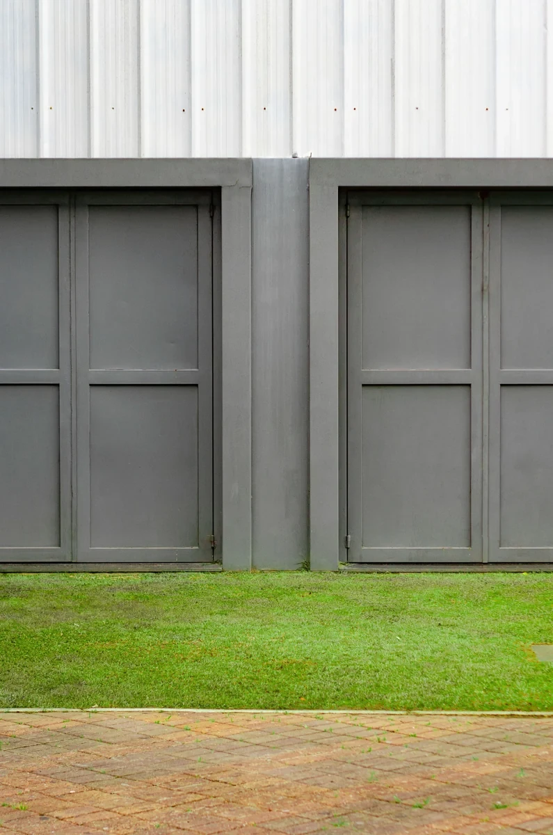 Close view of grey garage door panels and architectural detailing